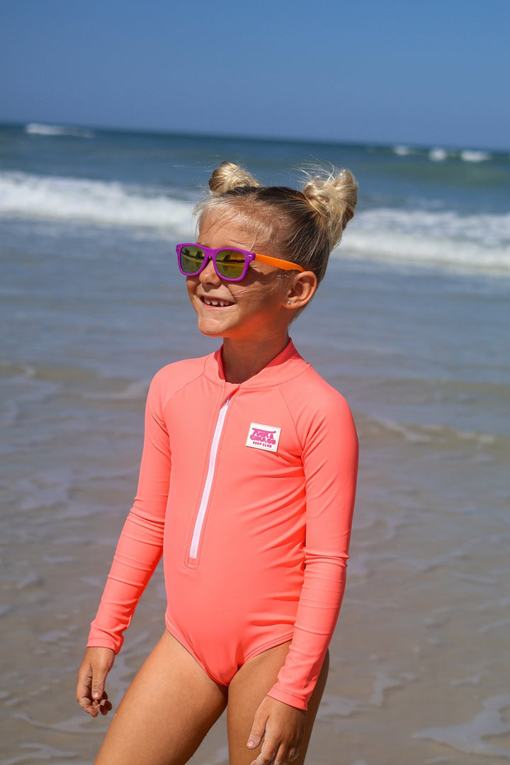 UPF 50+ Neon Coral Girls One Piece Long Sleeve Swimsuit - Tuck &amp; Char Co.