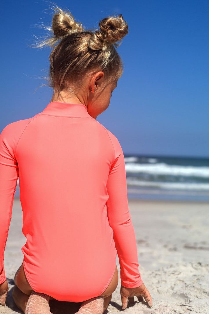 UPF 50+ Neon Coral Girls One Piece Long Sleeve Swimsuit - Tuck &amp; Char Co.