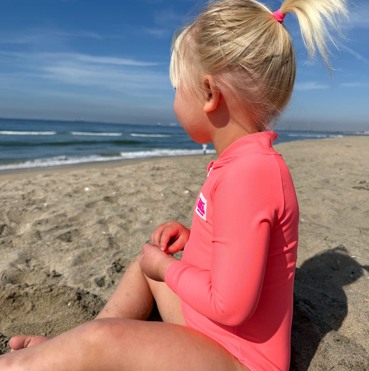 UPF 50+ Neon Coral Girls One Piece Long Sleeve Swimsuit - Tuck &amp; Char Co.