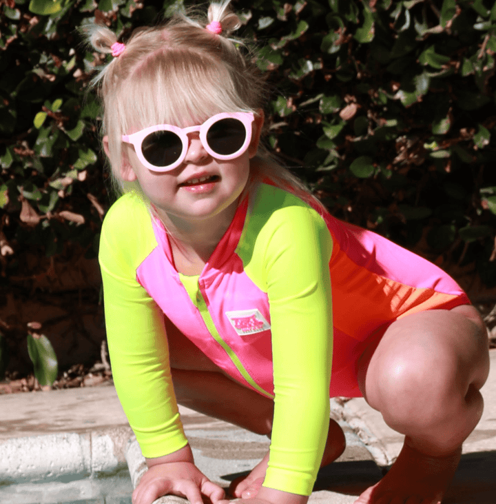 UPF 50+ Neon Pink Color Block Girls One Piece Long Sleeve Swimsuit - Tuck &amp; Char Co.