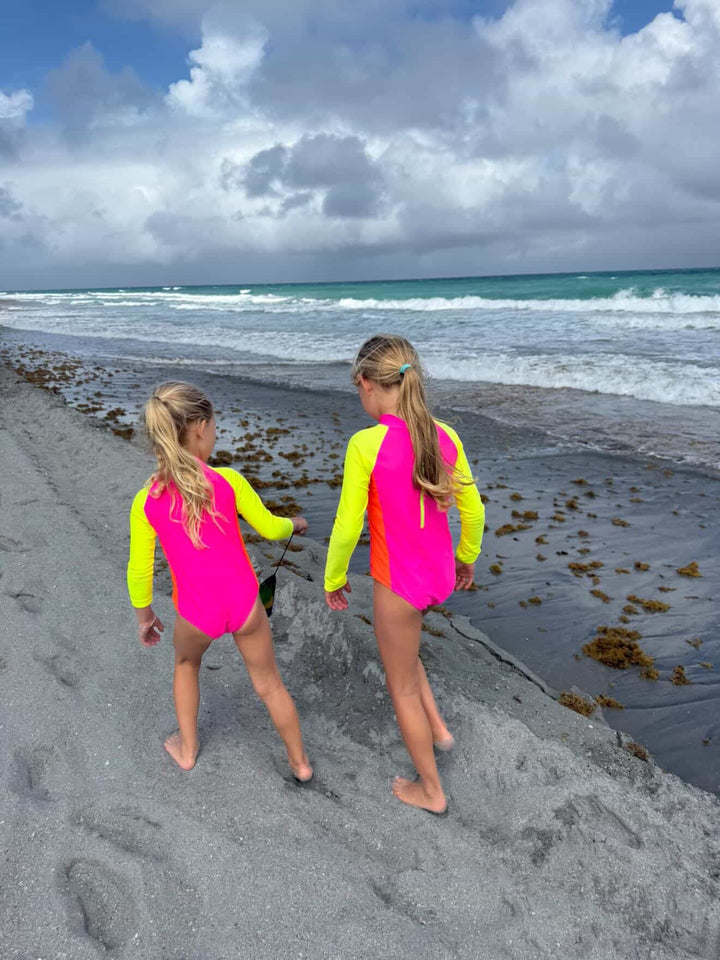 UPF 50+ Neon Pink Color Block Girls One Piece Long Sleeve Swimsuit - Tuck &amp; Char Co.
