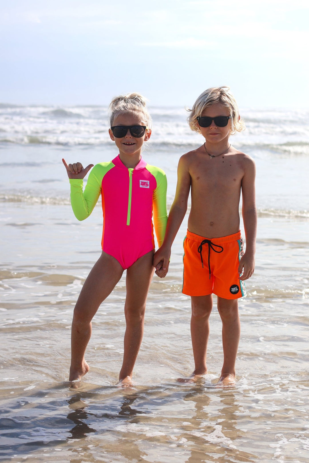 UPF 50+ Neon Pink Color Block Girls One Piece Long Sleeve Swimsuit - Tuck &amp; Char Co.