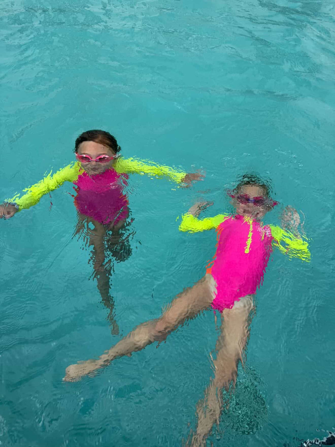 UPF 50+ Neon Pink Color Block Girls One Piece Long Sleeve Swimsuit - Tuck &amp; Char Co.